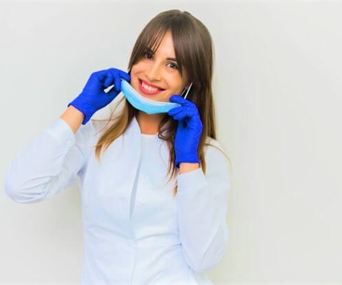 smiling-woman-posing-with-surgical-mask-gloves_23-2148380381